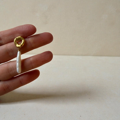 cycles with pearl drop earrings